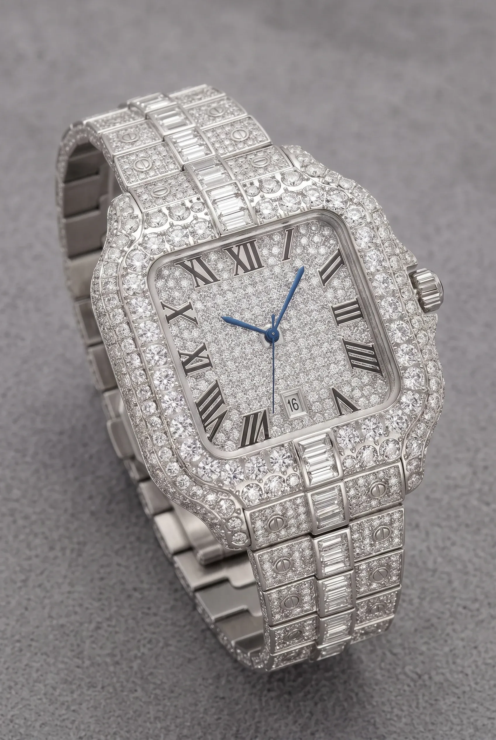 Close-up of a men's fully iced watch with stone-set bezel, dial, and bracelet on gray.