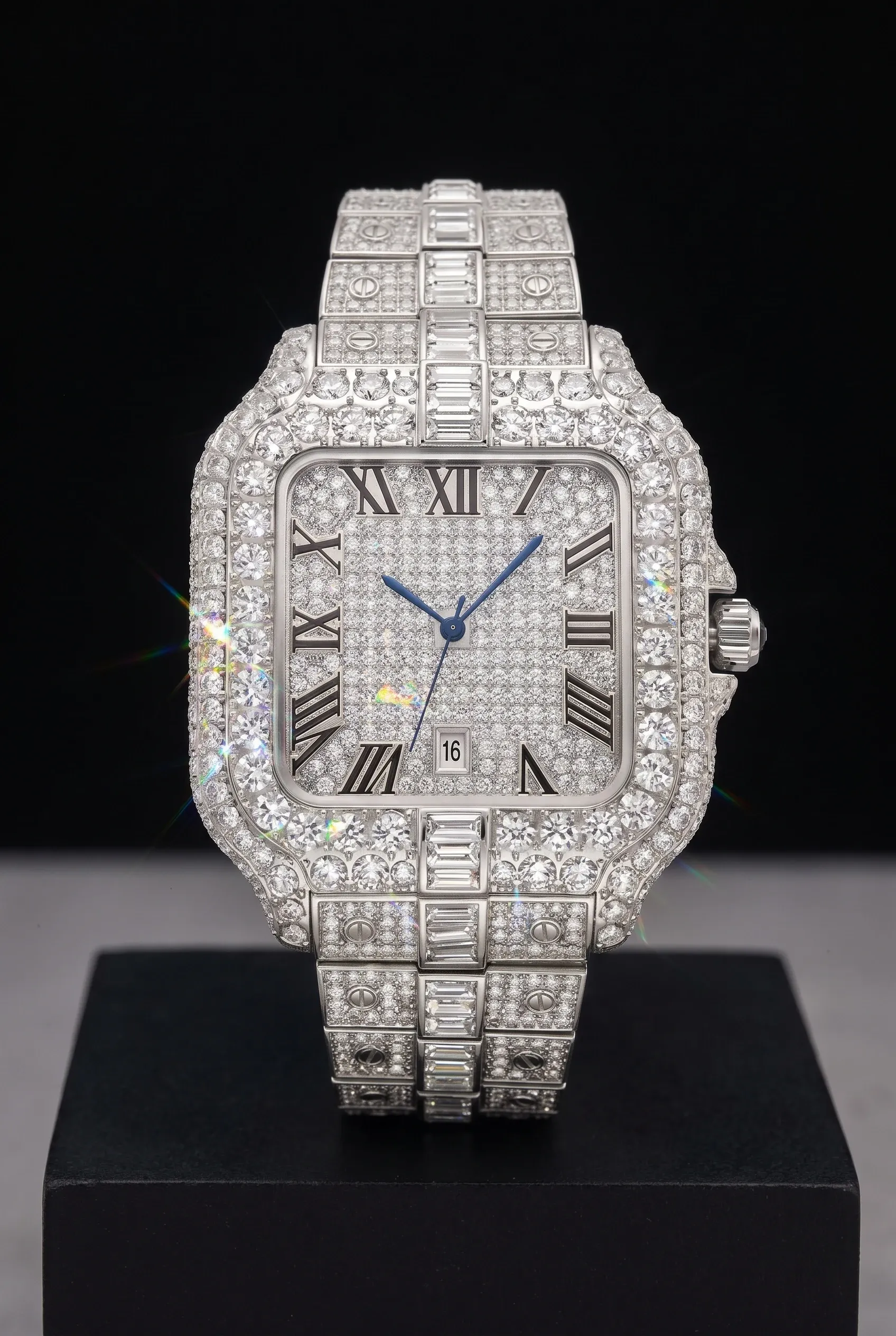 Close-up of a fully stone-set silver watch with crisp white and rainbow flashes