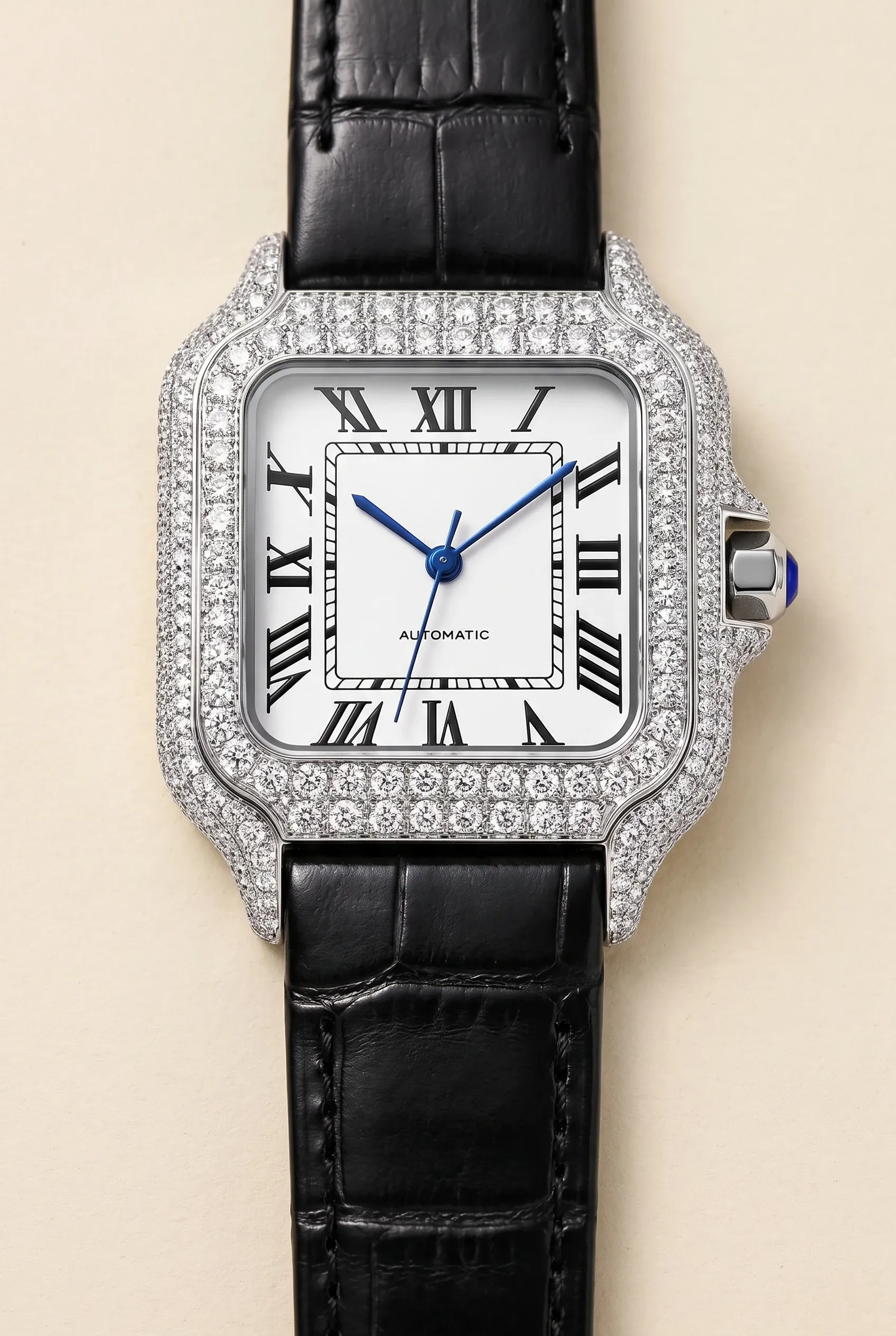 Square women’s moissanite watch in close-up, highlighting stone setting detail against a matte cream background.