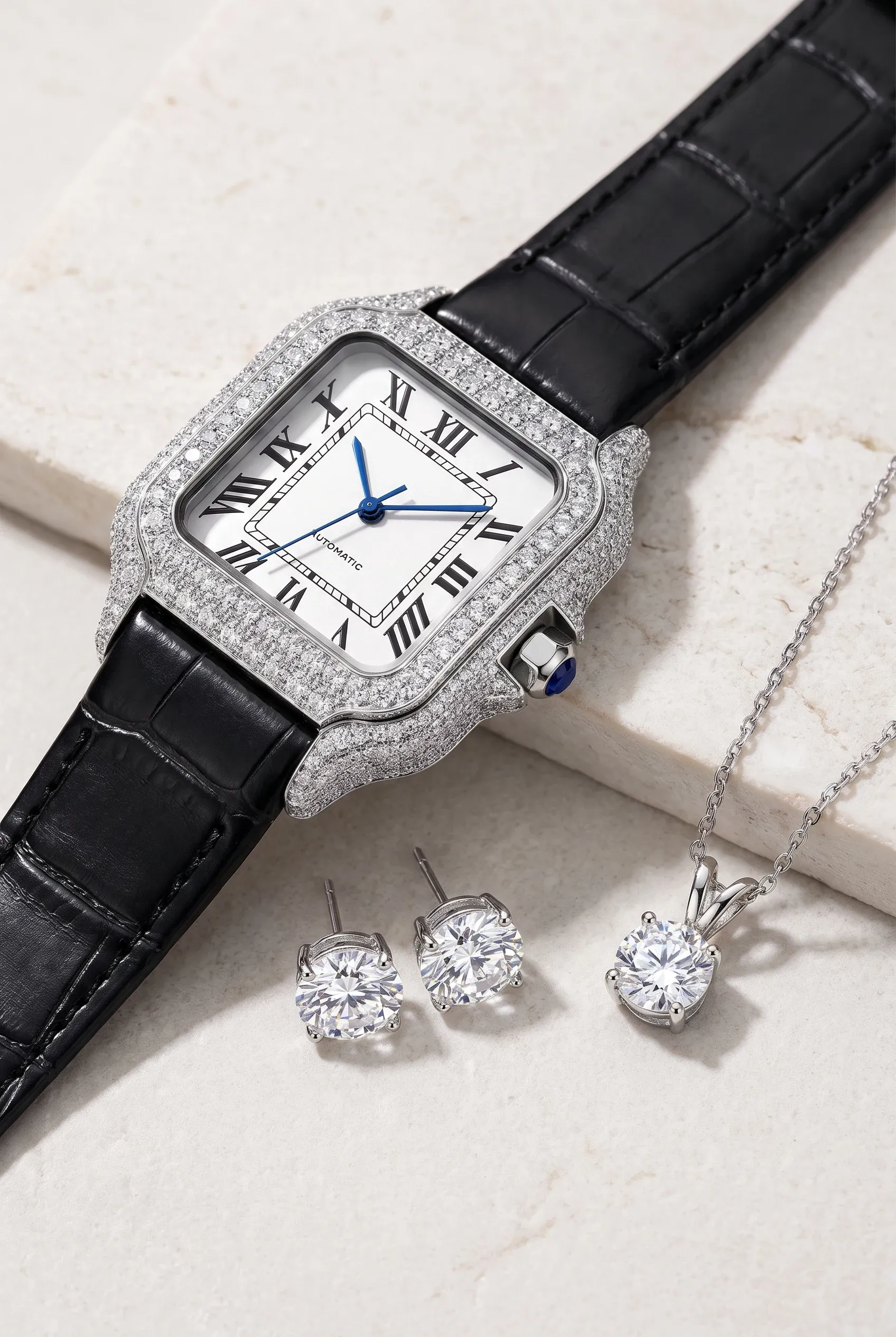 Close-up of moissanite stud earrings and a solitaire pendant with bright white sparkle on stone.