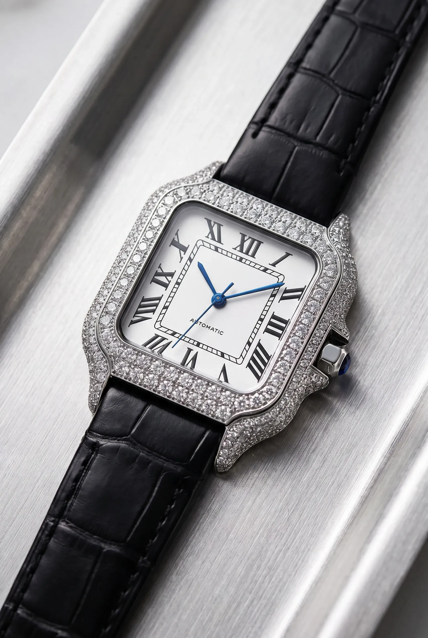 Square moissanite watch with a light dial and small white stones on a leather strap